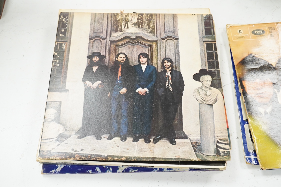 Eleven LP record albums including nine The Beatles and related albums; Beatles For Sale, Hey Jude, Yellow Submarine, All Things Must Pass, etc., together with the Rolling Stones; Their Satanic Majesties Request, and Pink
